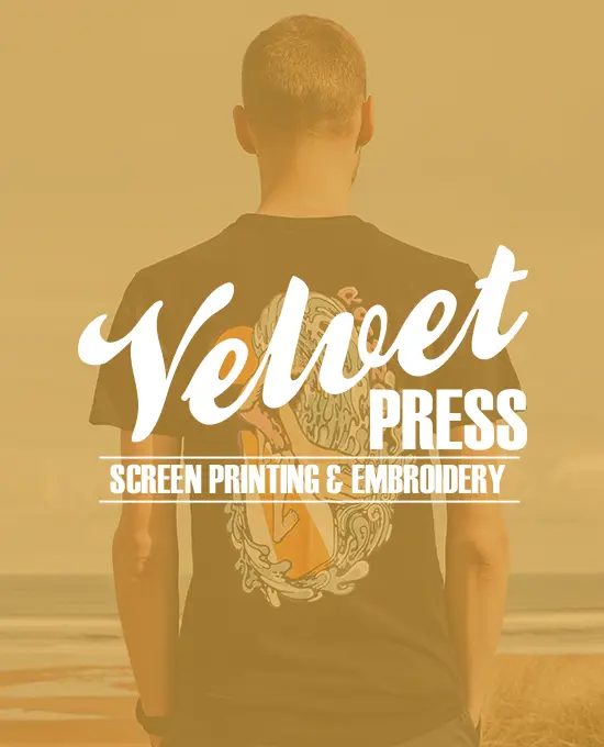 man on a beach looking at the ocean with a gold overlay and the velvet press logo