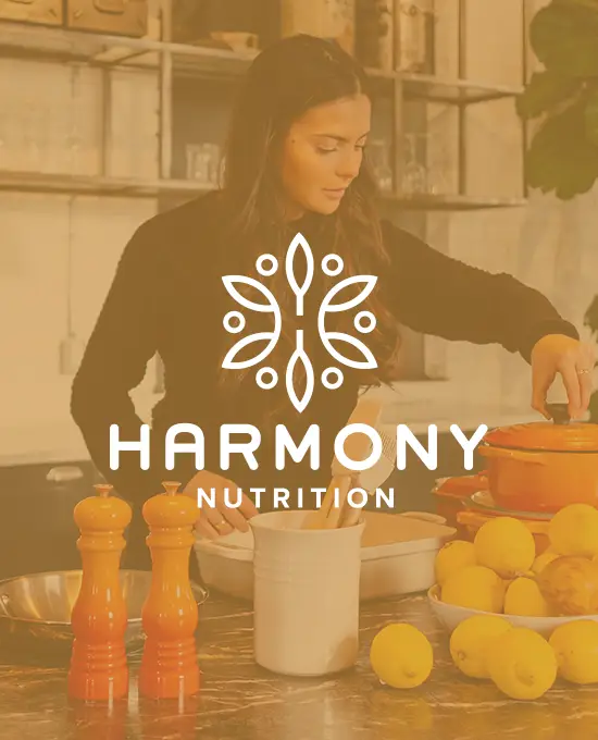 woman in a kitchen with harmony nutrition logo in front